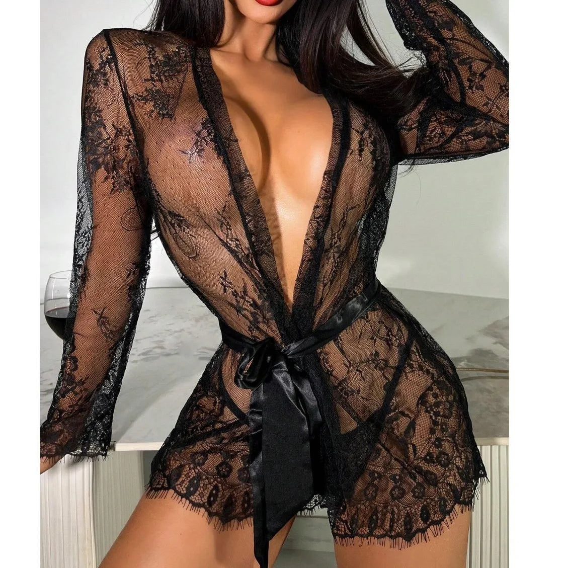 The Sexy Lace Robe Pajamas Set offers a sophisticated and sensual style for intimate nights. The delicate lace adds an alluring touch, while the soft fabric ensures comfort. Elevate your sleepwear with this elegant set.