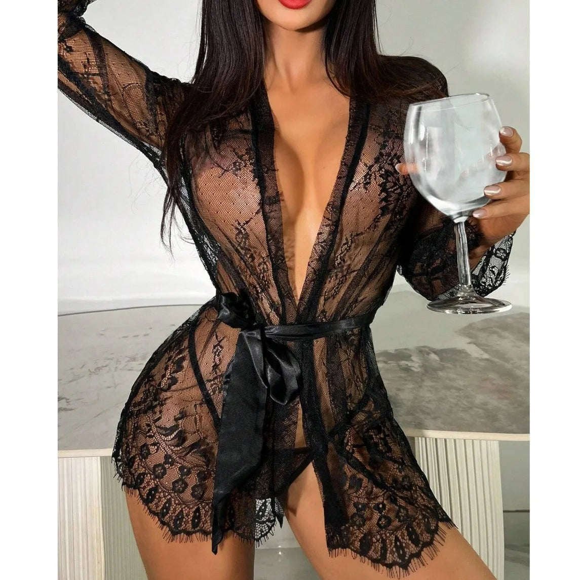 The Sexy Lace Robe Pajamas Set offers a sophisticated and sensual style for intimate nights. The delicate lace adds an alluring touch, while the soft fabric ensures comfort. Elevate your sleepwear with this elegant set.